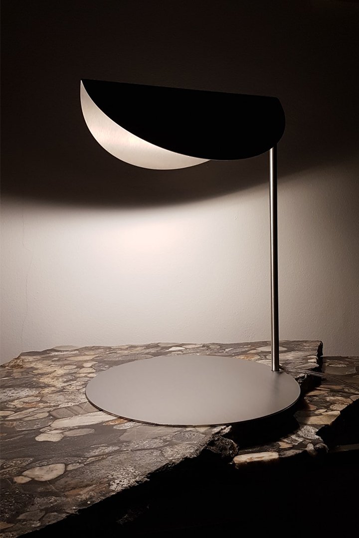 Contemporary Collectible Design Stainless Steel Desk Lamp on a table