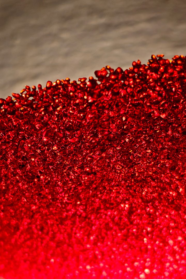 Red-glass-wall-lamp-detail Sculptural red glass wall sconce lamp detail